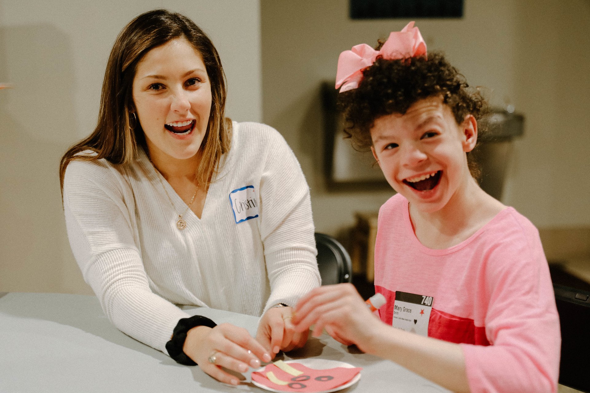 Volunteeer with Student with Special Needs craft
