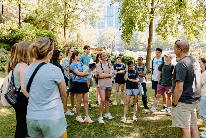 Interns Standing in Circle on Grass at Kairos Day Away