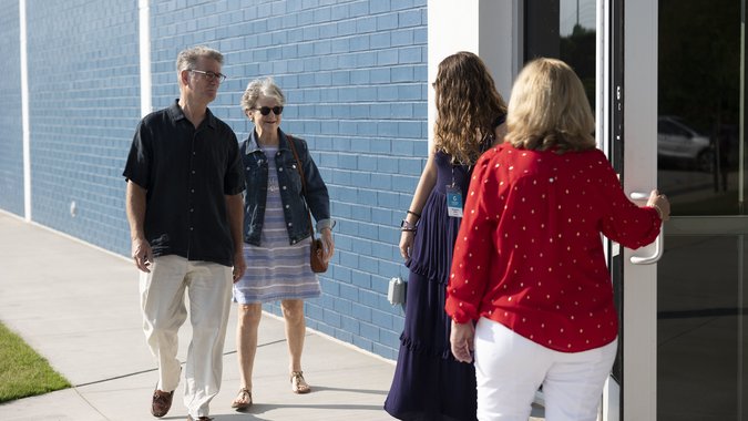 Greeters welcoming couple