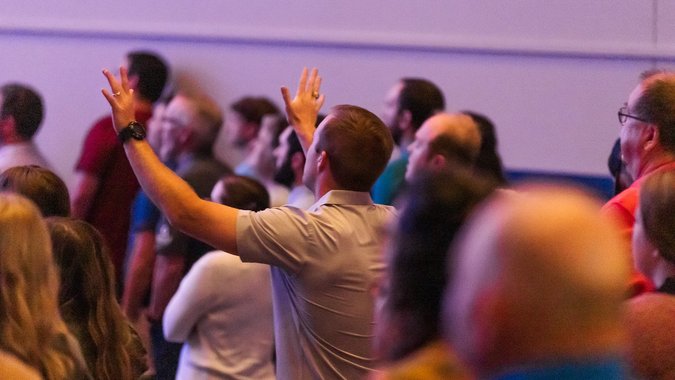 Man raising hands in worship