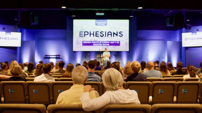 Couple sitting together in service