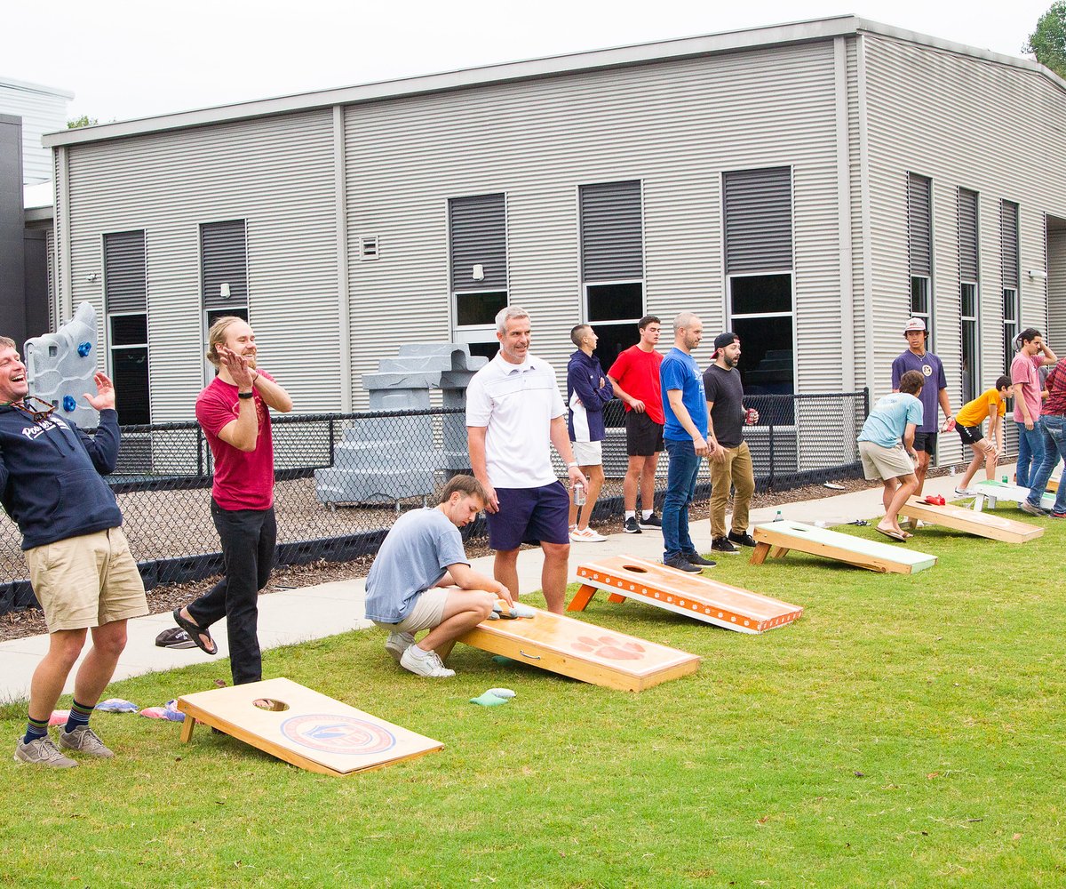 Players participating in cornhole tournament