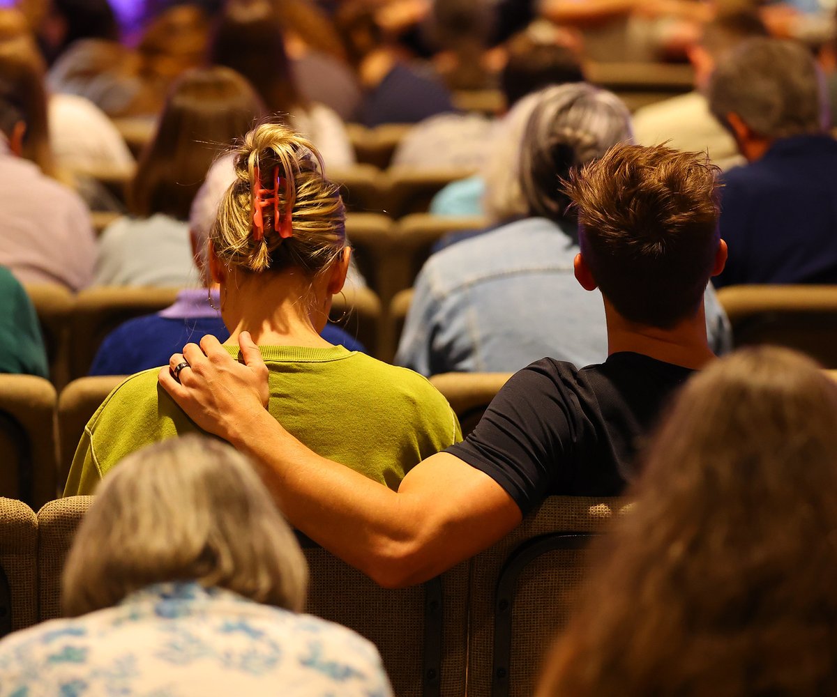Couple sitting together in service
