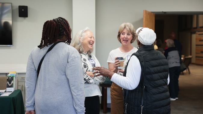 Women smiling in lobby