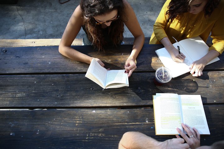 Group of Three Studying Together
