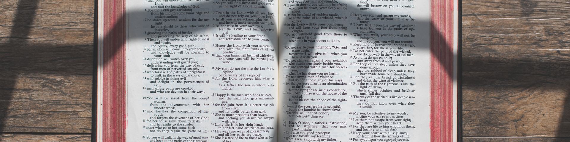 Cross Shadow over Open Bible