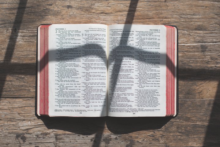 Cross Shadow over Open Bible