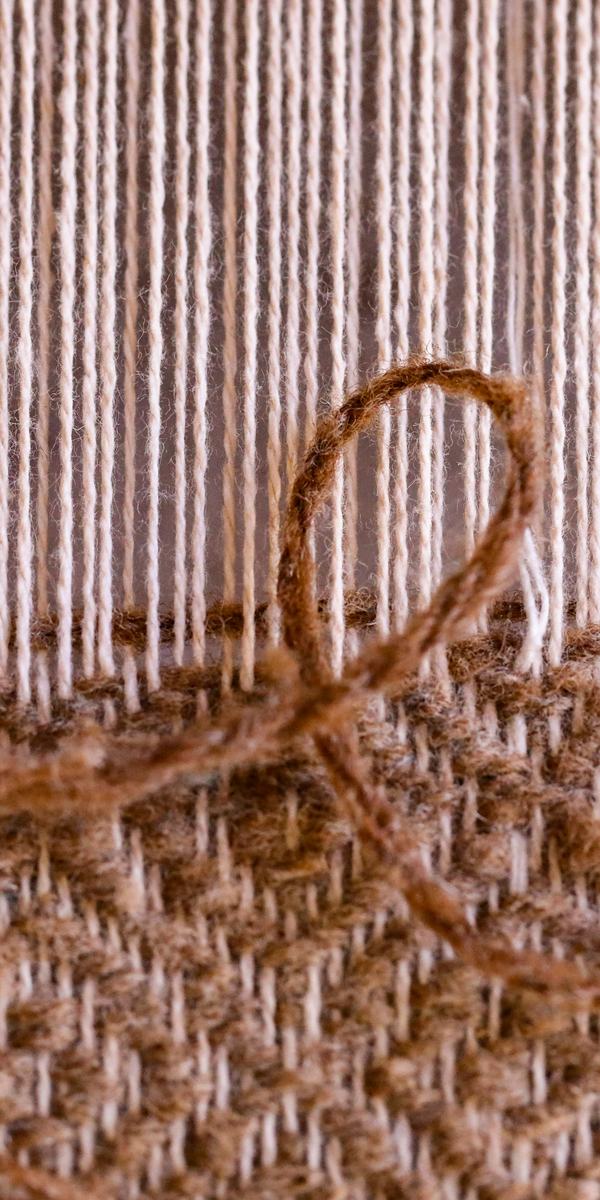 Thread weaving through fabric