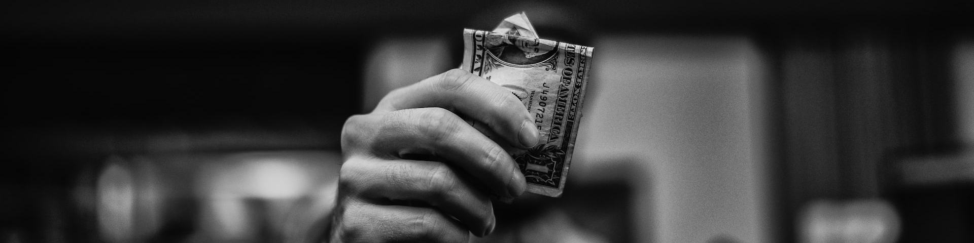 Generous Hand Holding Out Money