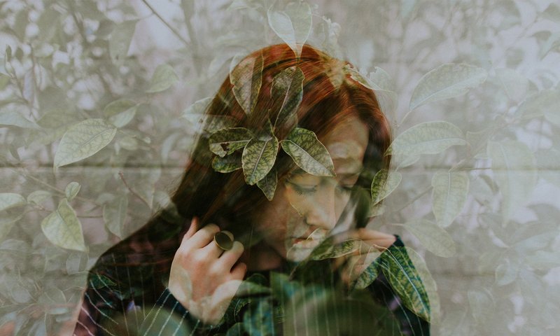 Woman Behind Greenery