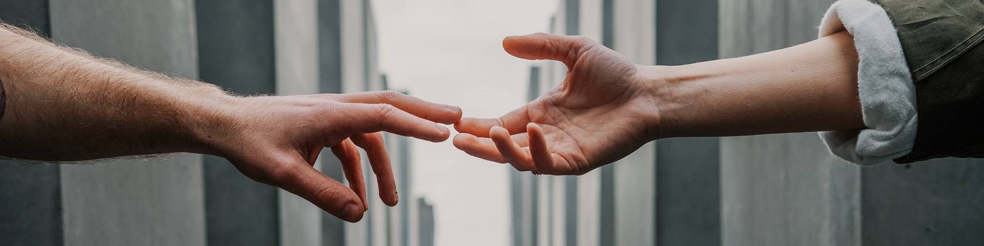 Hands Reaching for Each Other